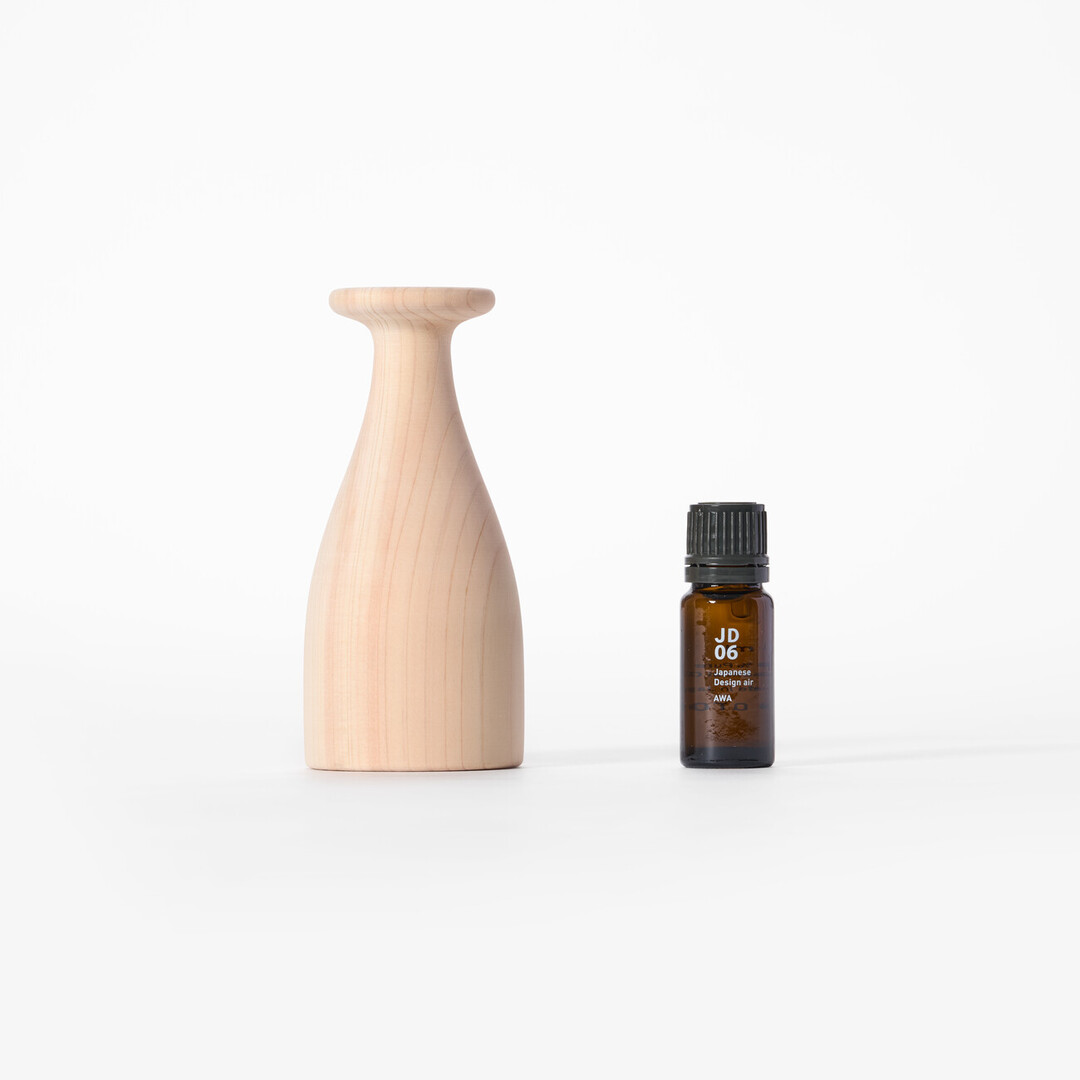 Wooden aroma diffuser and a bottle of aroma oil from Japan House London.