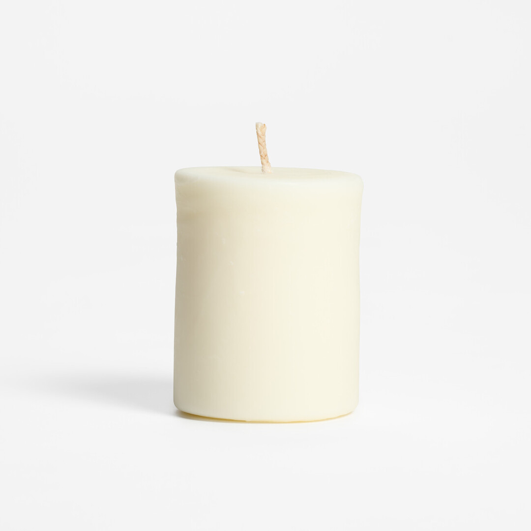 A white candle for refilling scented aroma candle with Shigaraki-yaki holder from Japan House London.