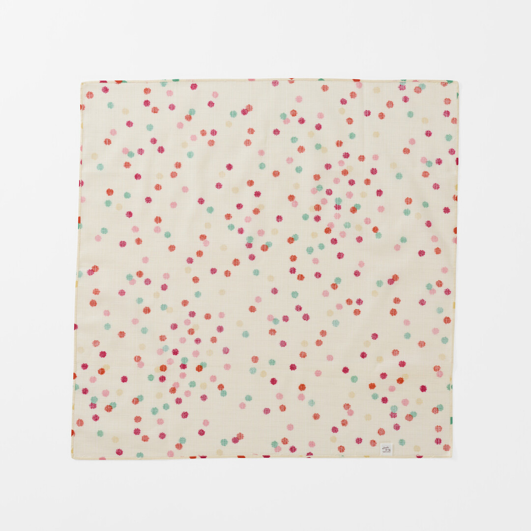 The underside of Furoshiki Kompeito which has a cream background with multi colour small dots from Japan House London.