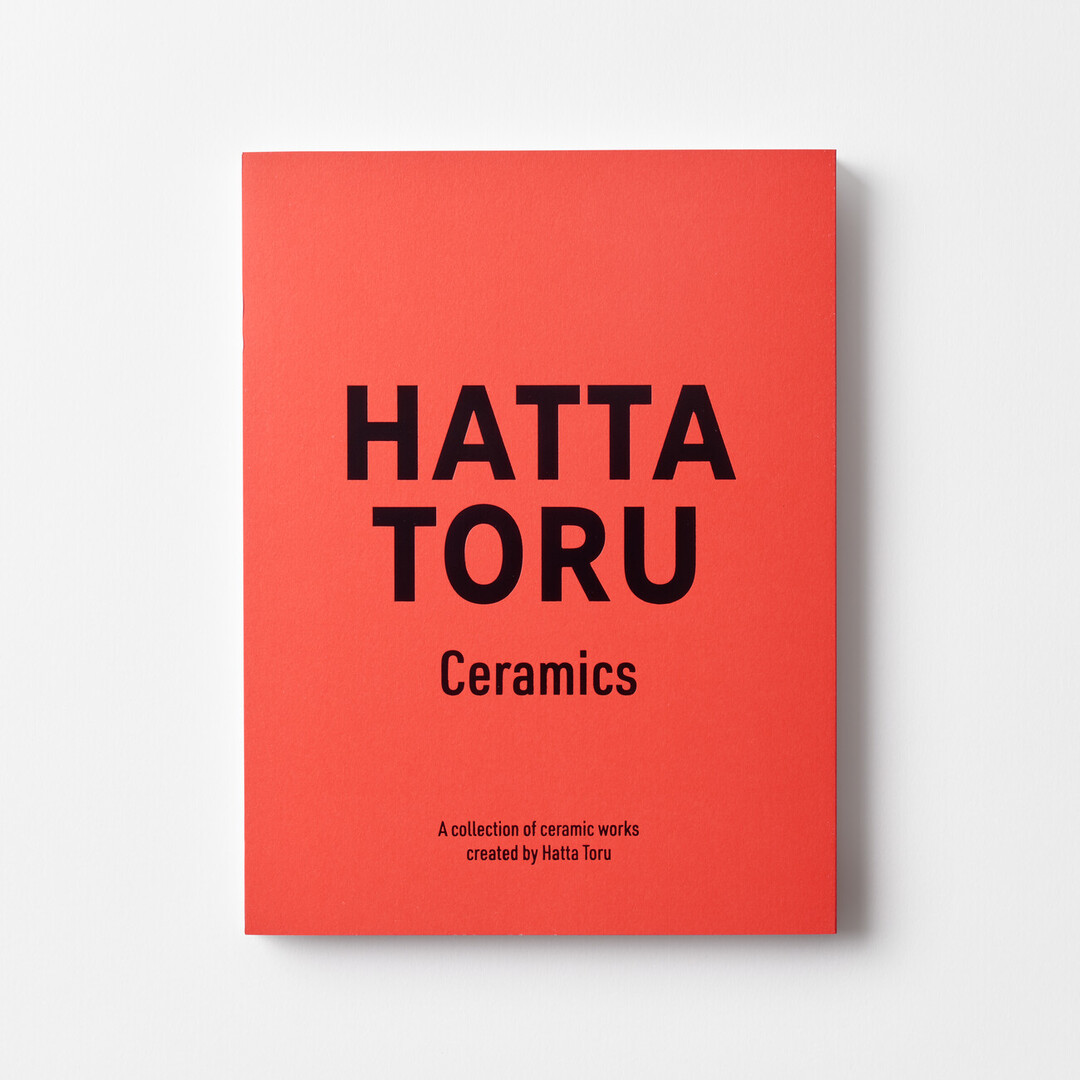 A bright orange cover of the book HATTA TORU Ceramics from Japan House London.