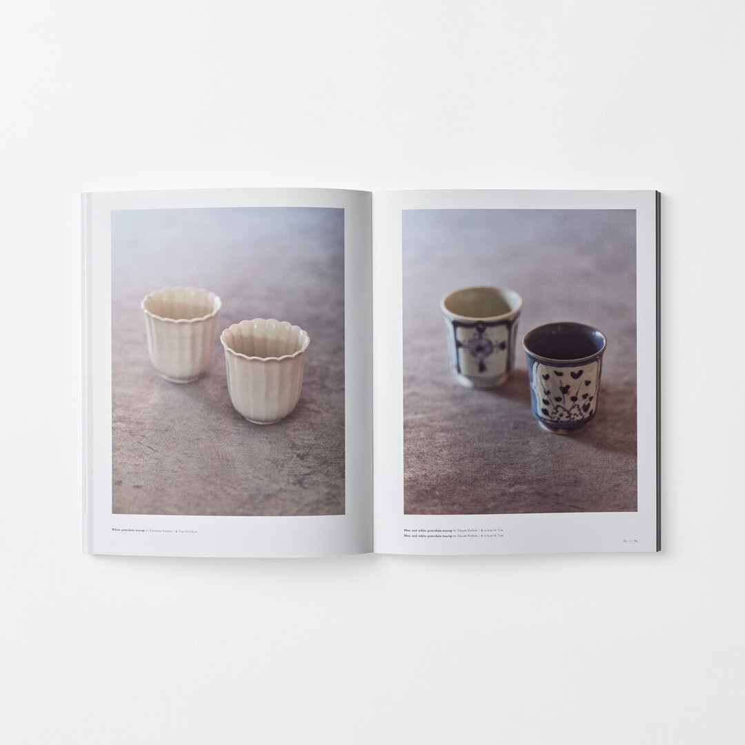 A spread in the book Utsukushi Utsuwa with four ceramic cups from Japan House London.
