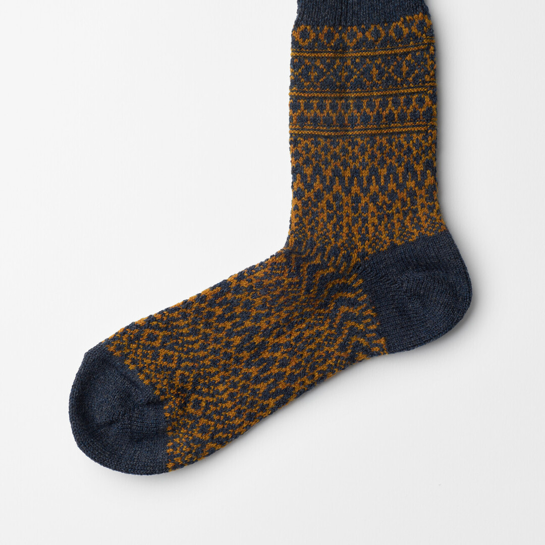 The Wool Jacquard Socks in navy by Nishiguchi Kutsushita from Japan House London.