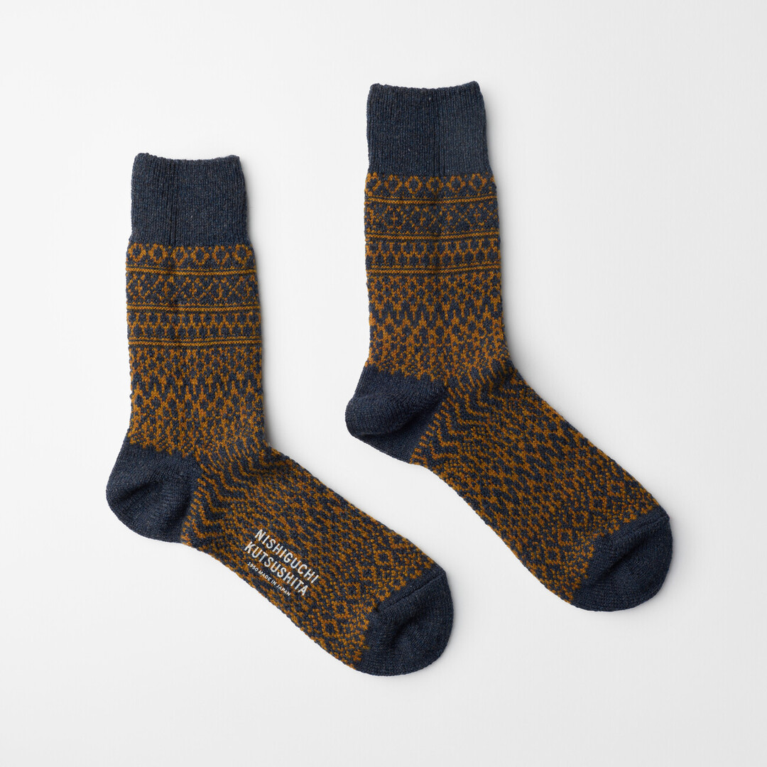 The Wool Jacquard Socks in navy by Nishiguchi Kutsushita from Japan House London.