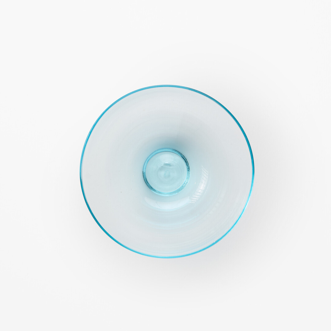 A blown glass sake cup by Arinaga Kōta from Japan House London.