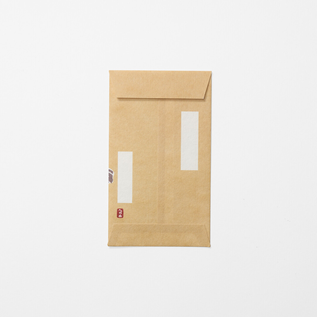 Pochibukuro, a small, yellow envelope for gifting money with decorative horse pattern from Japan House London.