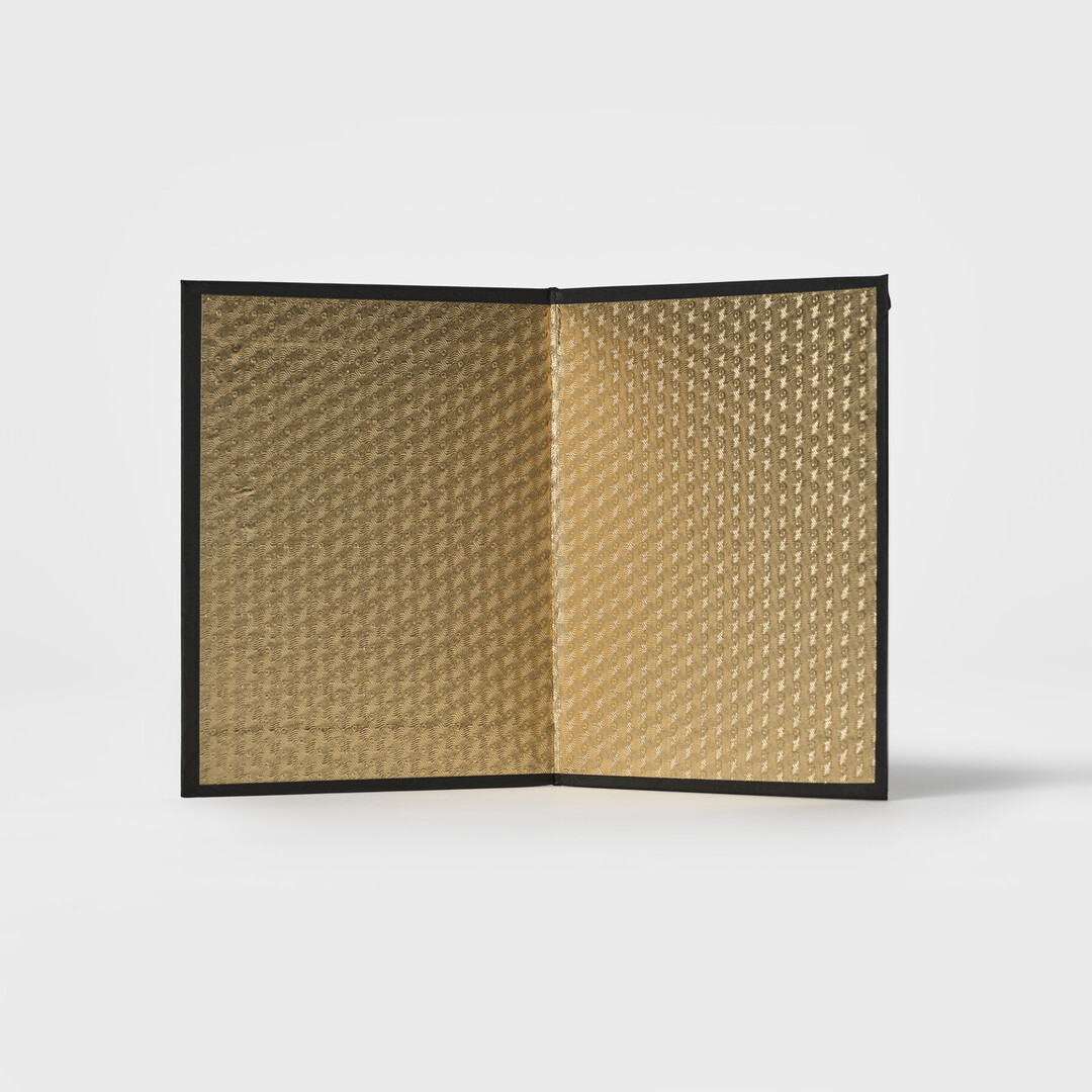 A folded gold screen from Japan House London.