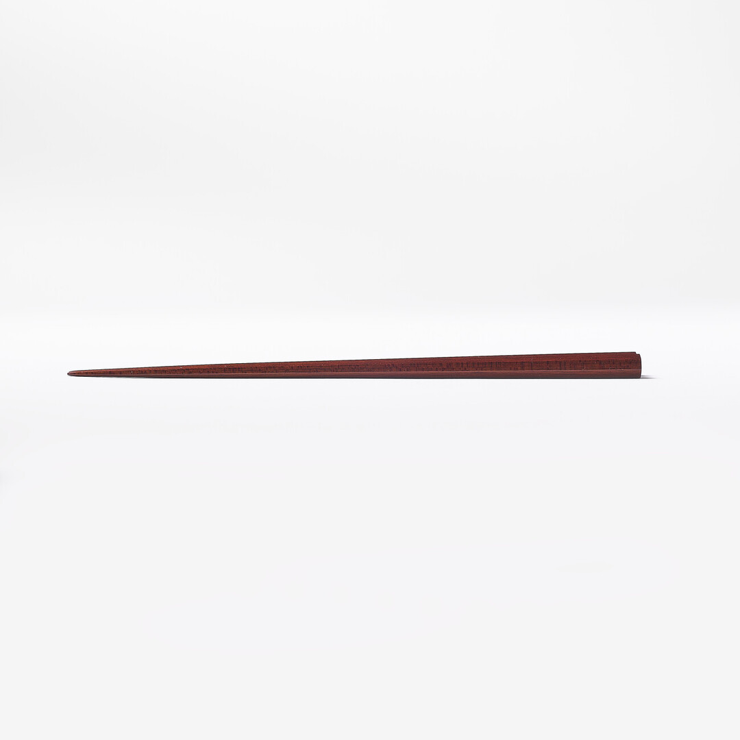 Dark brown Heptagon Satine Chopsticks by Daikokuya from Japan House London.