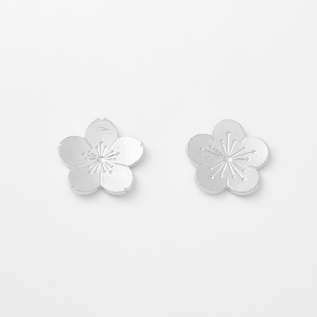 Sakura and plum flower shaped tin chopstick rests by Nousaku from Japan House London.