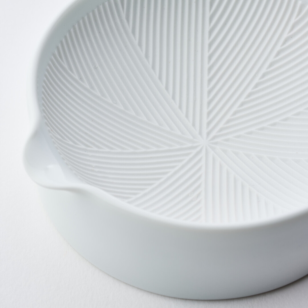 A white porcelain mortar by Kihara from Japan House London.