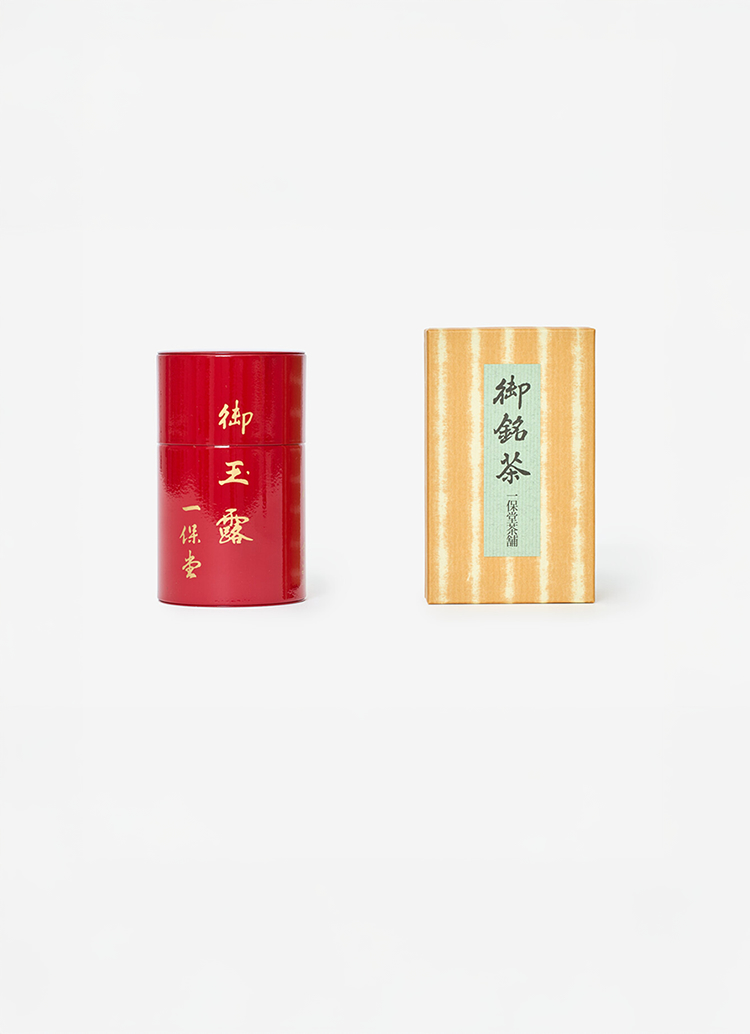 A red can of Gyokuro tea from Ippodo next to a brown box packaging.