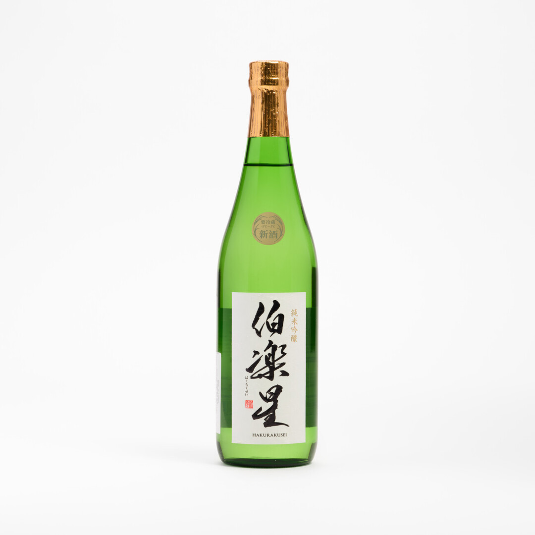A green bottle of Hakurakusei Junmai Ginjo sake from Japan House London.