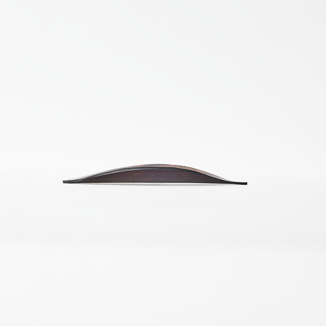 A leaf shaped tea scoop made from sakura tree bark by Tomioka Shoten from Japan House London.