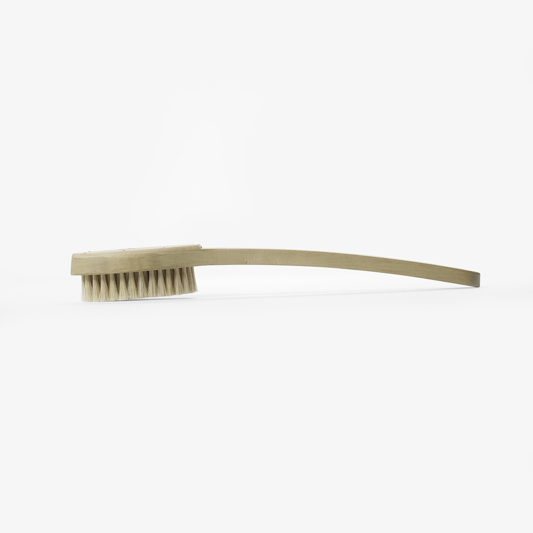 A wooden body brush by Unohake from Japan House London.