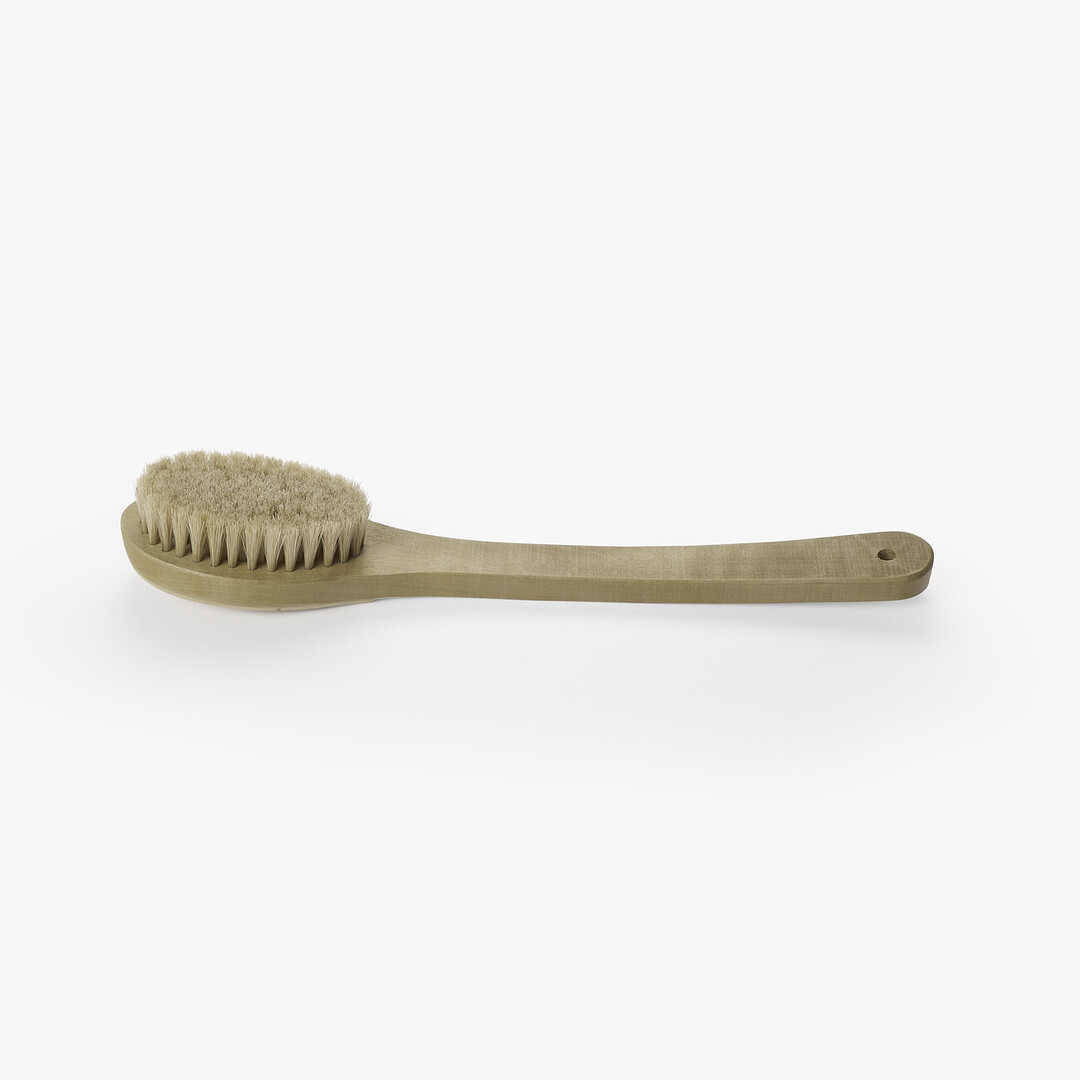 A wooden body brush by Unohake from Japan House London.