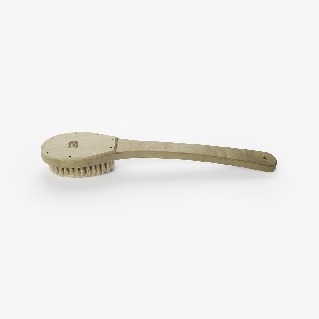 A wooden body brush by Unohake from Japan House London.