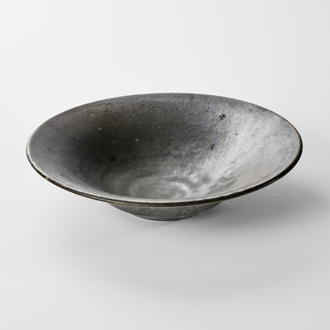 A large bowl with black glaze by Shimomura Atsushi from Japan House London.