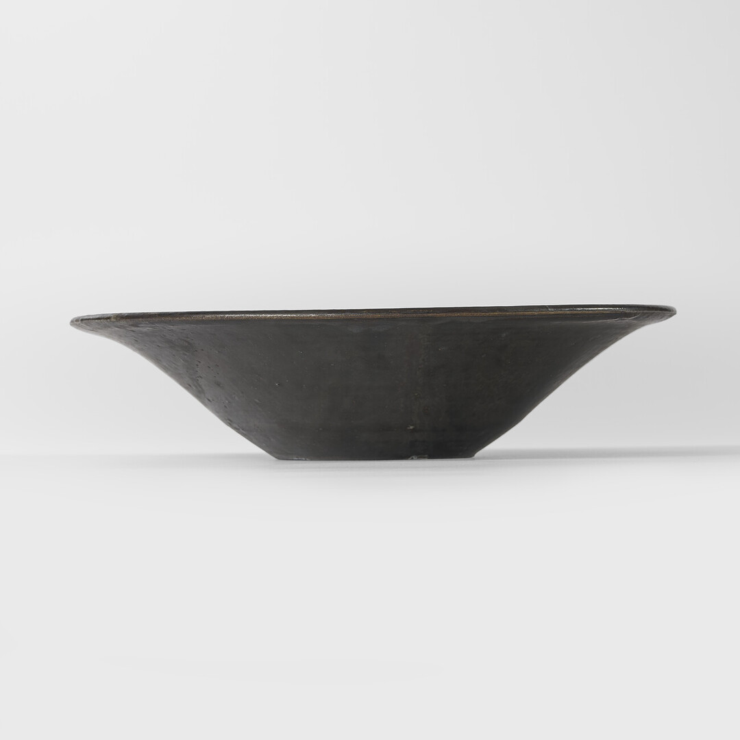 A large bowl with black glaze by Shimomura Atsushi from Japan House London.