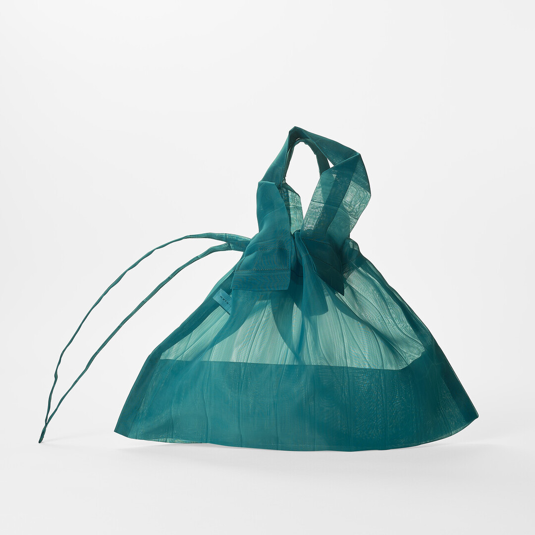 A turquoise translucent bag by mate mono from Japan House London.