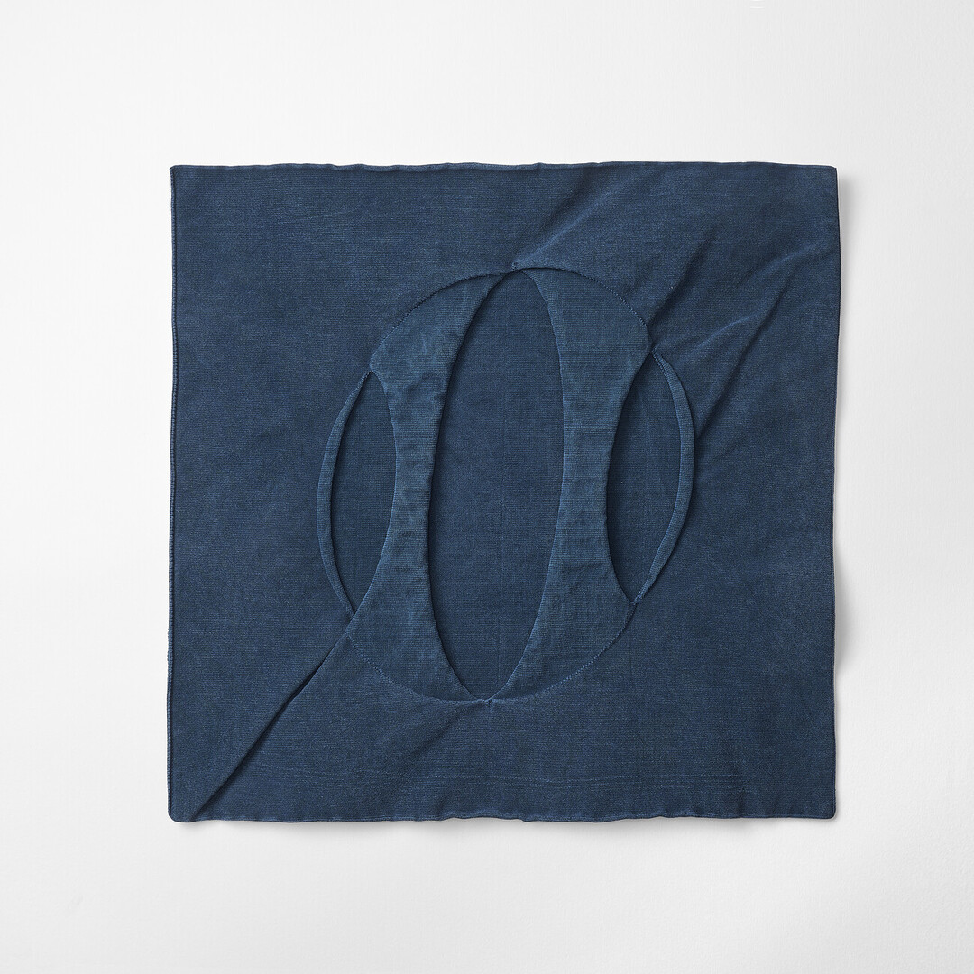 A navy blue bag shaped in a flat square by mate mono from Japan House London.