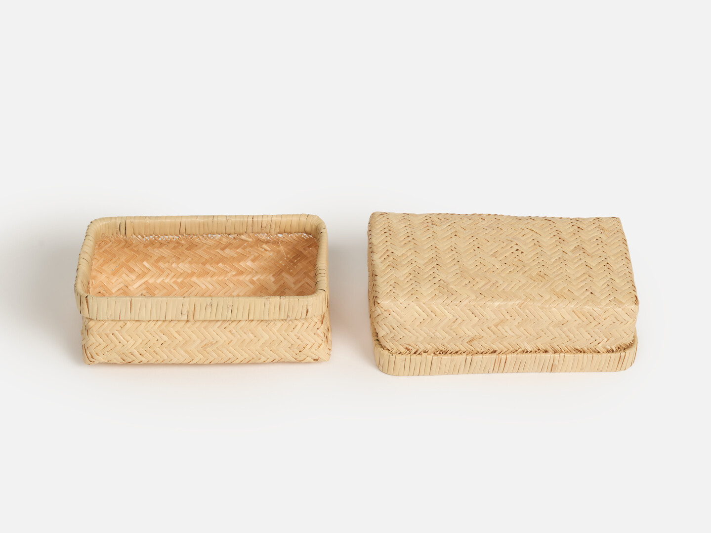 A lid and body of rectangular woven bamboo sandwich box by Matsunoya from Japan House London.