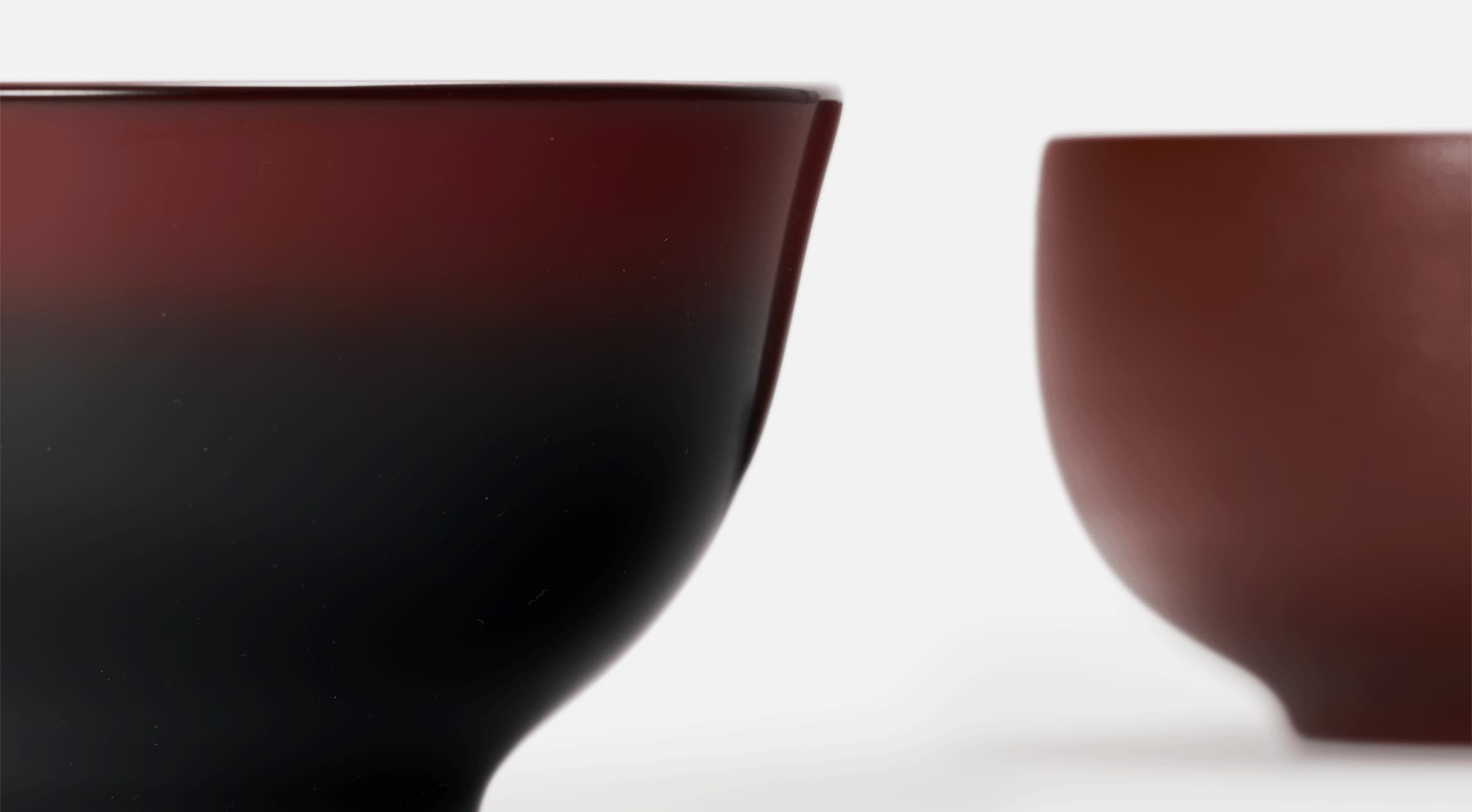 Two red lacquered bowls from Japan House London.