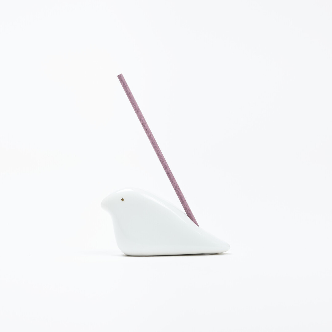 A dove shaped white porcelain incense holder by Kyukudo with incense from Japan House London.