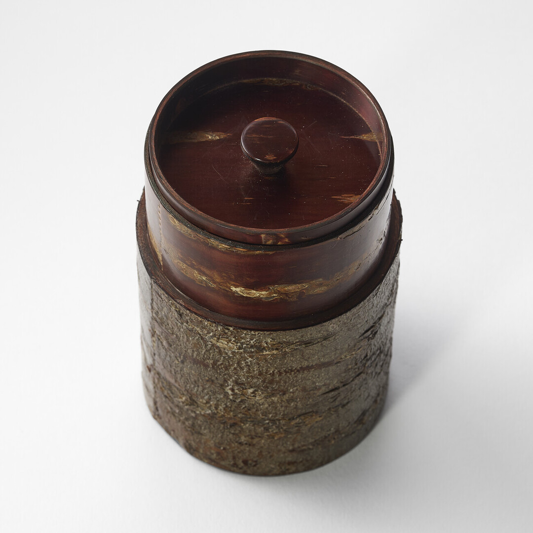 A tea caddy made from cherry bark by Tomioka Shoten from Japan House London.