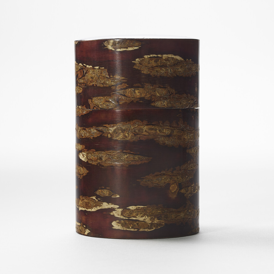 A deep red brown polished cherry bark tea caddy by Tomioka Shoten from Japan House London.