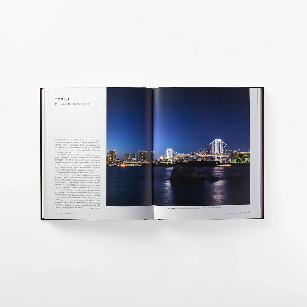 A spread of Whisky Japan: The Essential Guide to the World's Most Exotic Whisky with image of Tokyo Minato district from Japan House London.