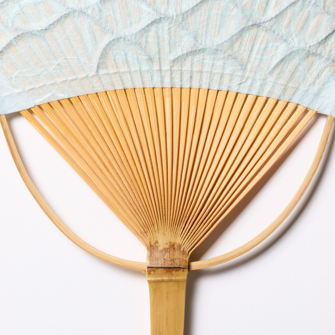 Light blue textured Japanese Bamboo Paper Square-Topped Fan by Uchiwaya Ryō from Japan House London.
