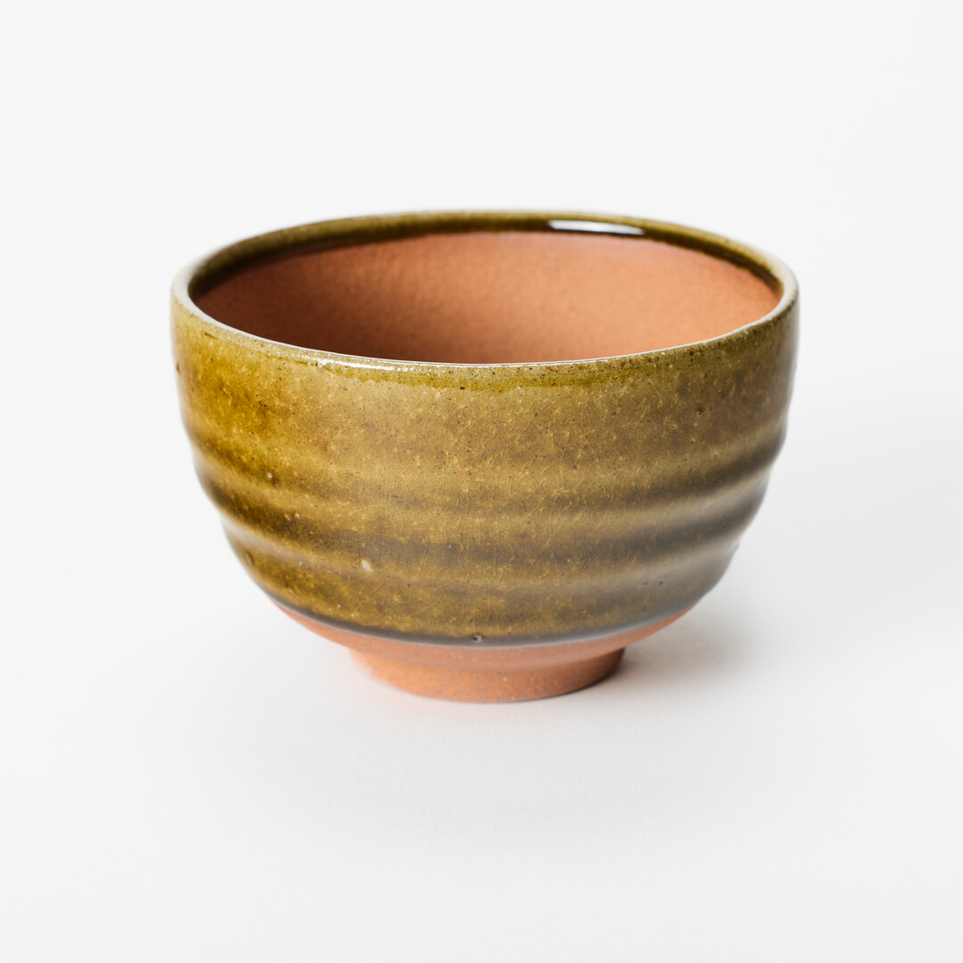 A Shigaraki-yaki plant pot with brown glaze from Japan House London