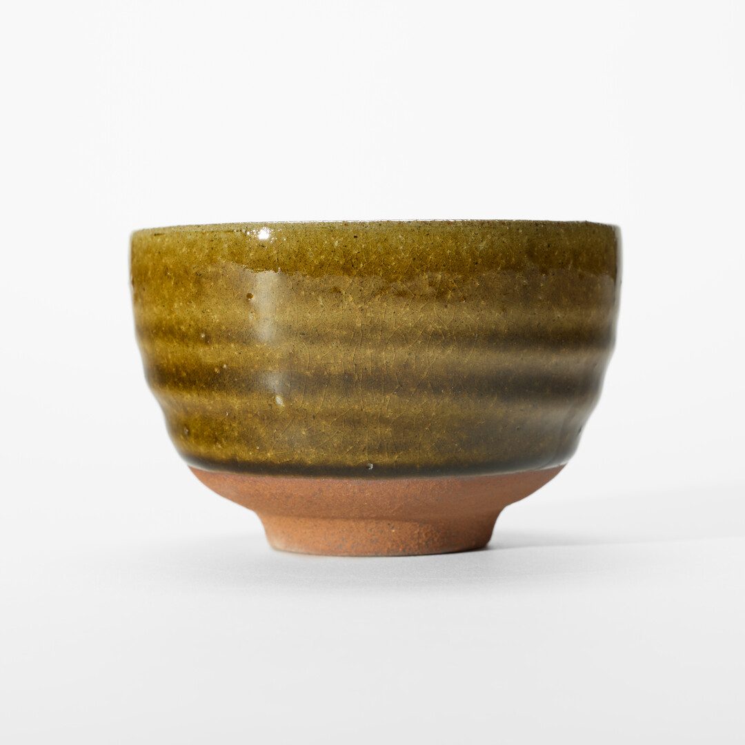A Shigaraki-yaki plant pot with brown glaze from Japan House London