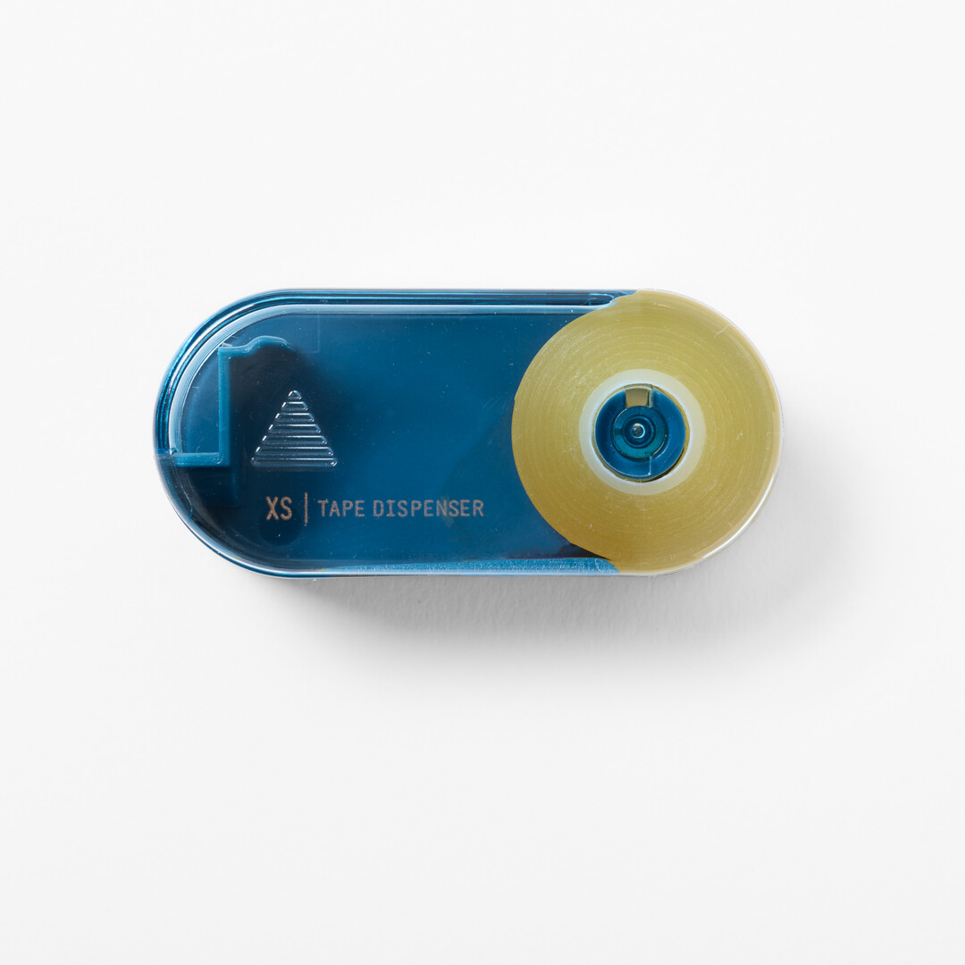 Small plastic tape dispenser, Midori XS Tape Dispenser in navy from Japan House London.