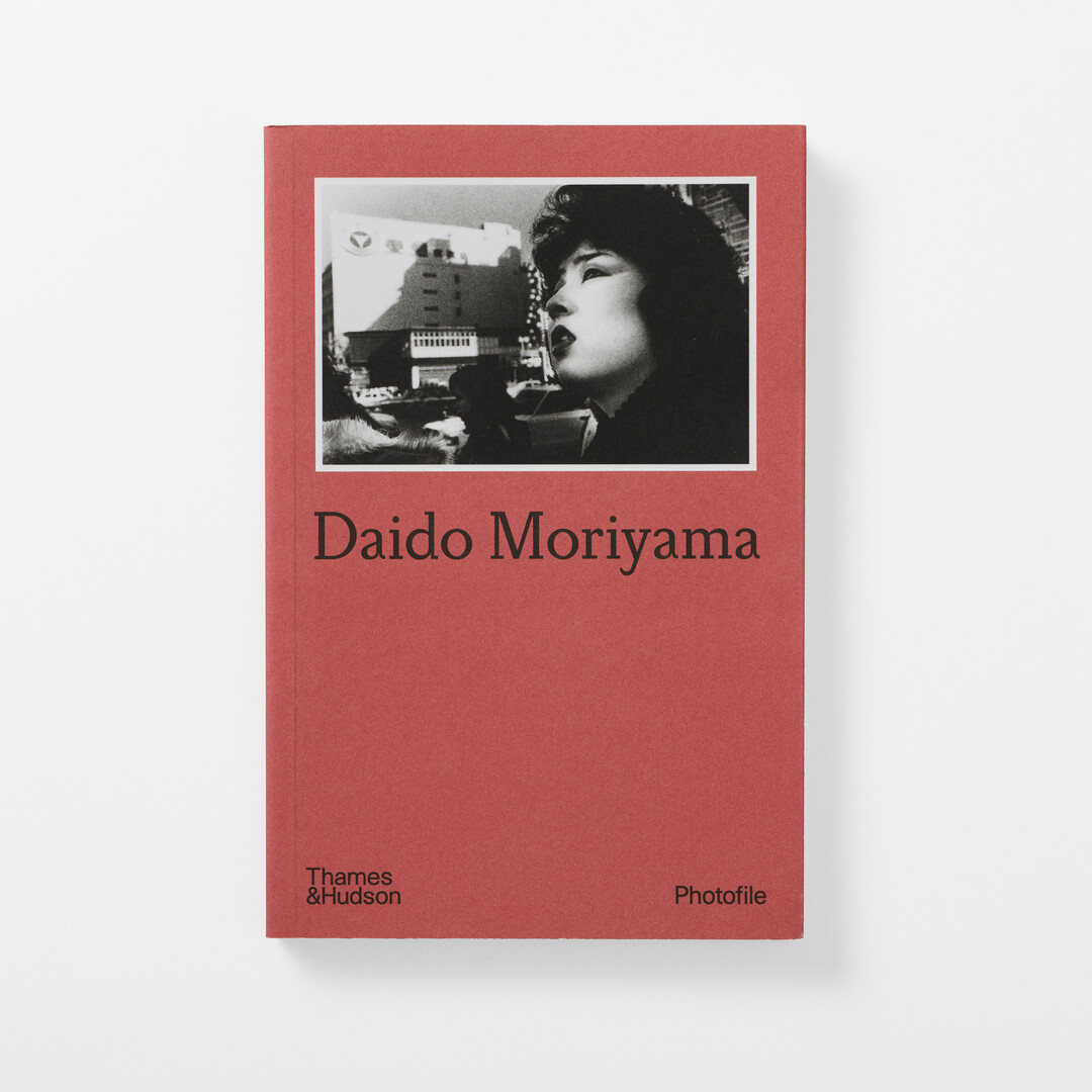 The dark pink cover of Moriyama Daidō's photo file with black and white photograph from Japan House London.