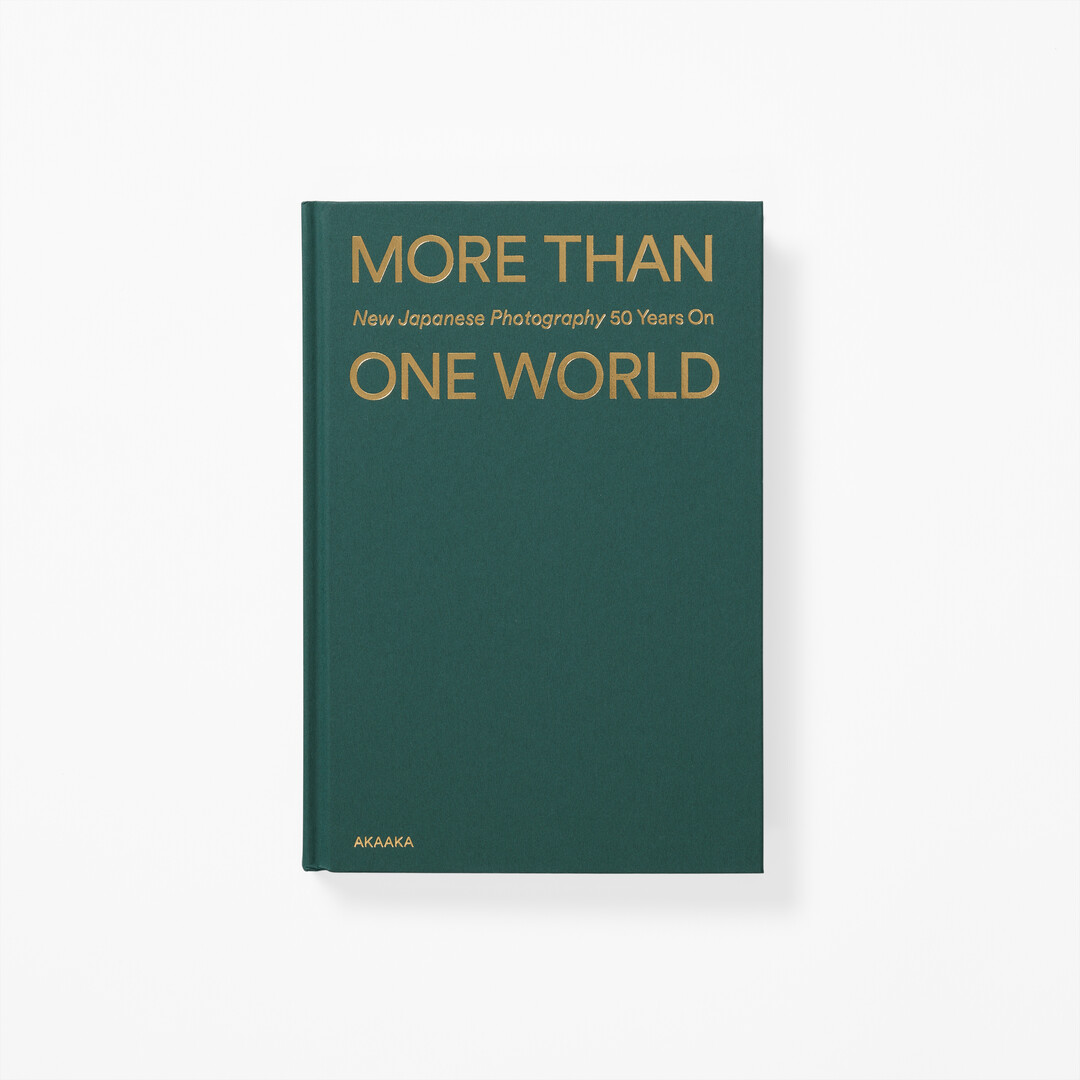 Book of More Than One World - New Japanese Photography 50 Years On with dark green background and gold title from Japan House London.