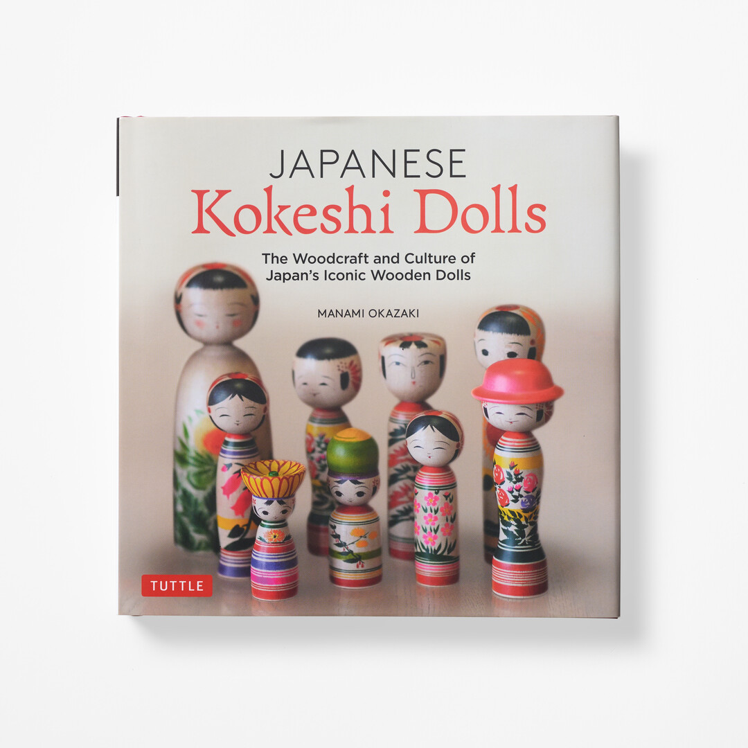 A cover with photograph of kokeshi from book Japanese Kokeshi Dolls from Japan House London.