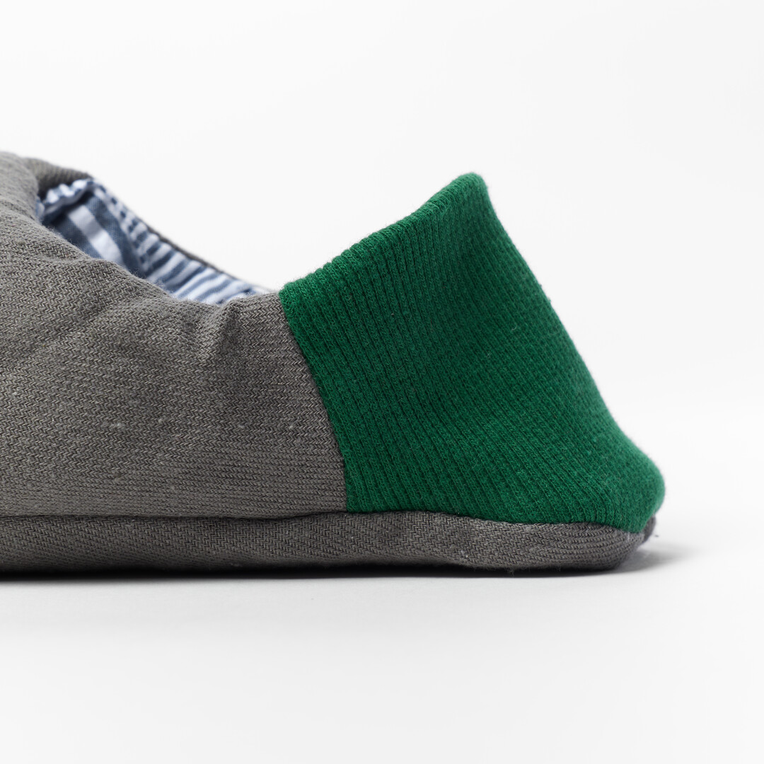 Merippa slipper with grey body and green heel from Japan House London.