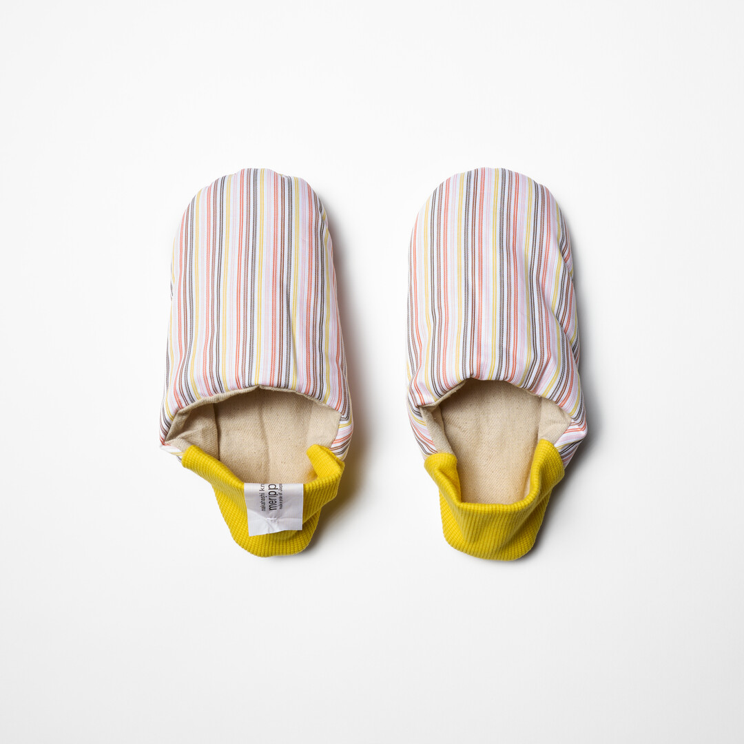 Pick Stripe Knapsack Merippa Slippers with pink and brown stripes on beige background and yellow heel from Japan House London.