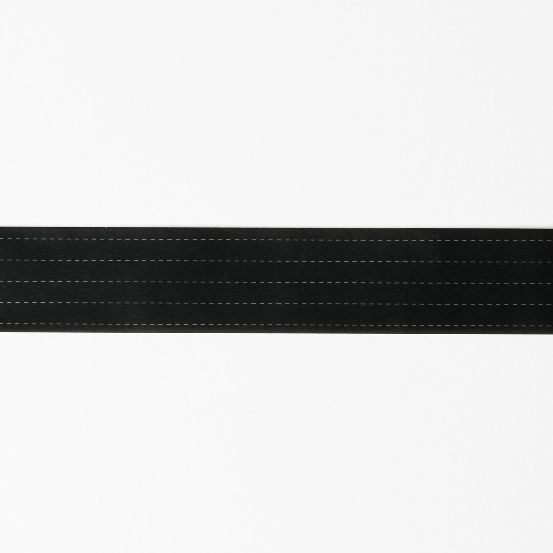Washi tape with white dotted lines with black background design for writing and drawing on from Japan House London.