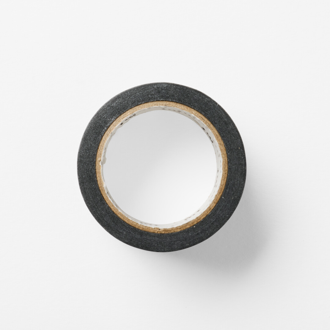 Washi tape with white dotted lines with black background design for writing and drawing on from Japan House London.