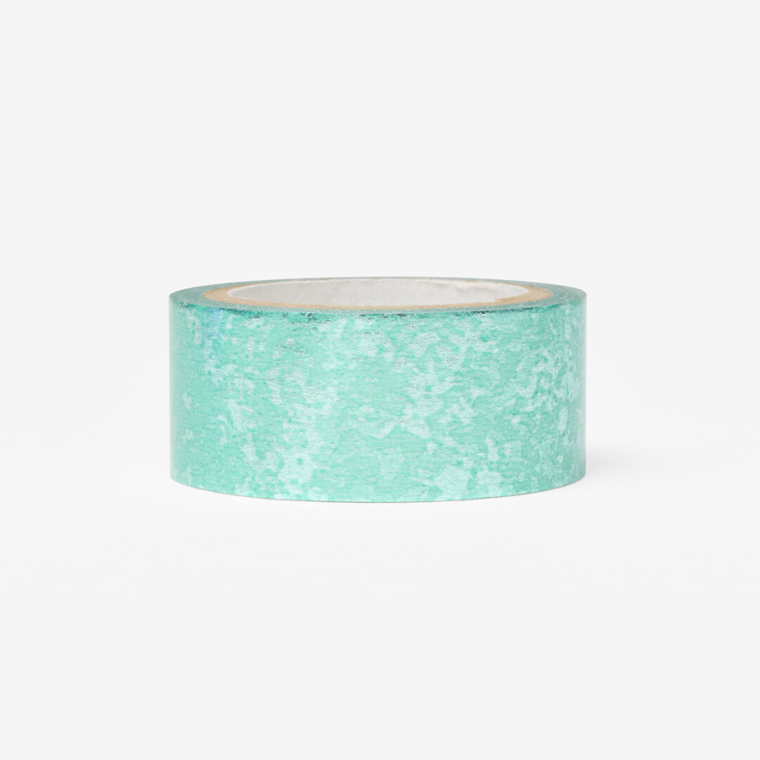 Washi tape with a light green background with a metalic pattern that creates an eye-catching sheen from Japan House London.