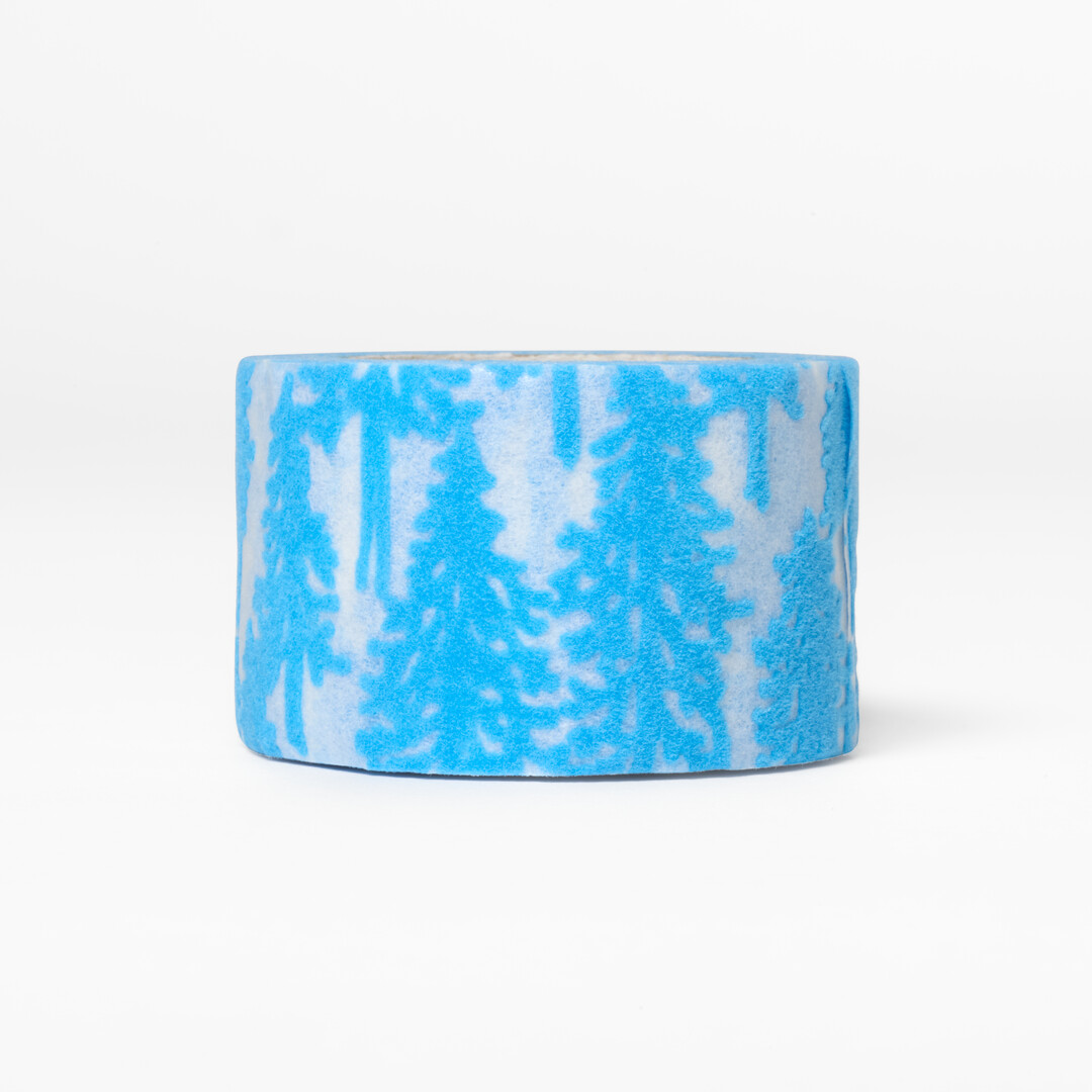 Washi tape designed by minä perhonen with a flocked tree pattern from Japan House London.