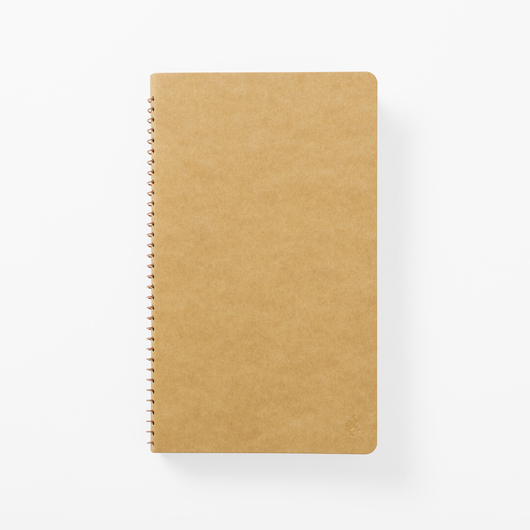 The cover of TRC Slim Spiral Ring Kraft Notebook A5 open from Japan House London.