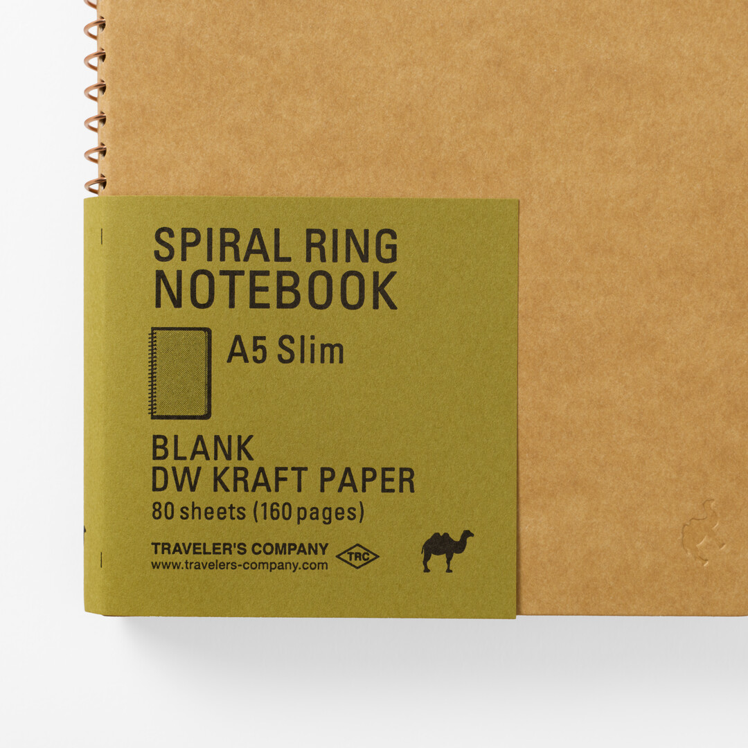 The cover of TRC Slim Spiral Ring Kraft Notebook A5 open from Japan House London.