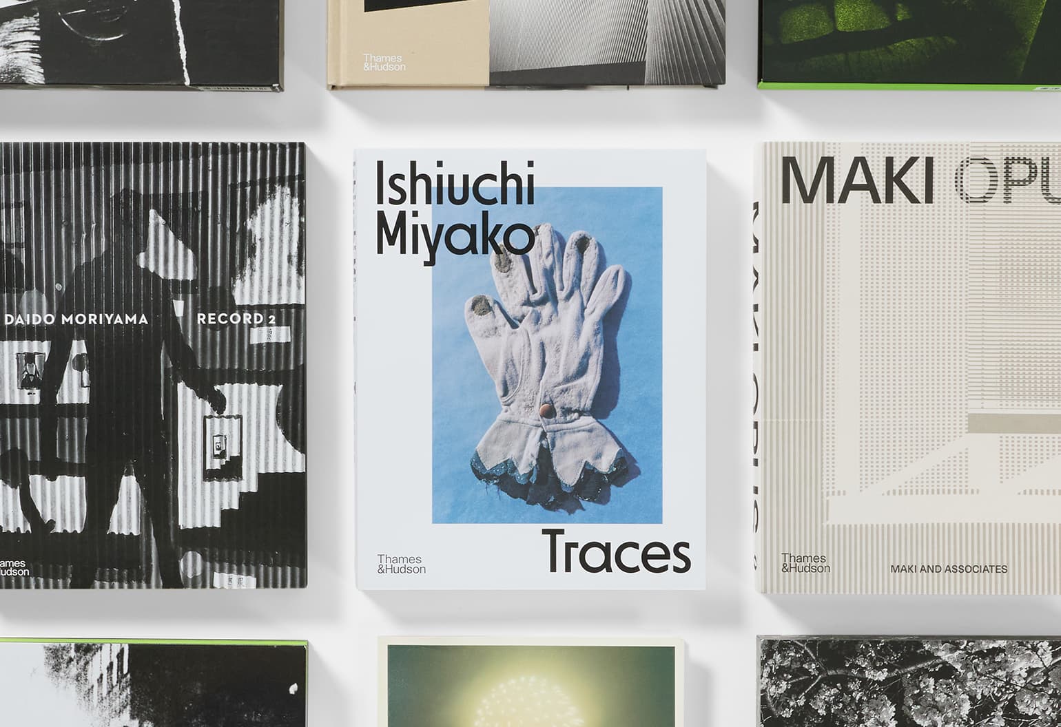 Rows of books with Japanese photography from Japan House London.