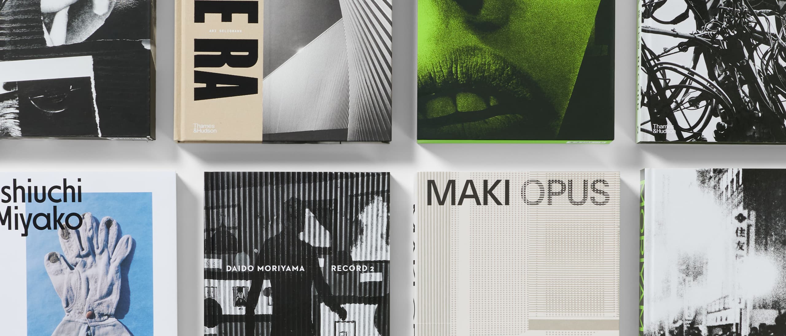 Rows of books with Japanese photography from Japan House London.