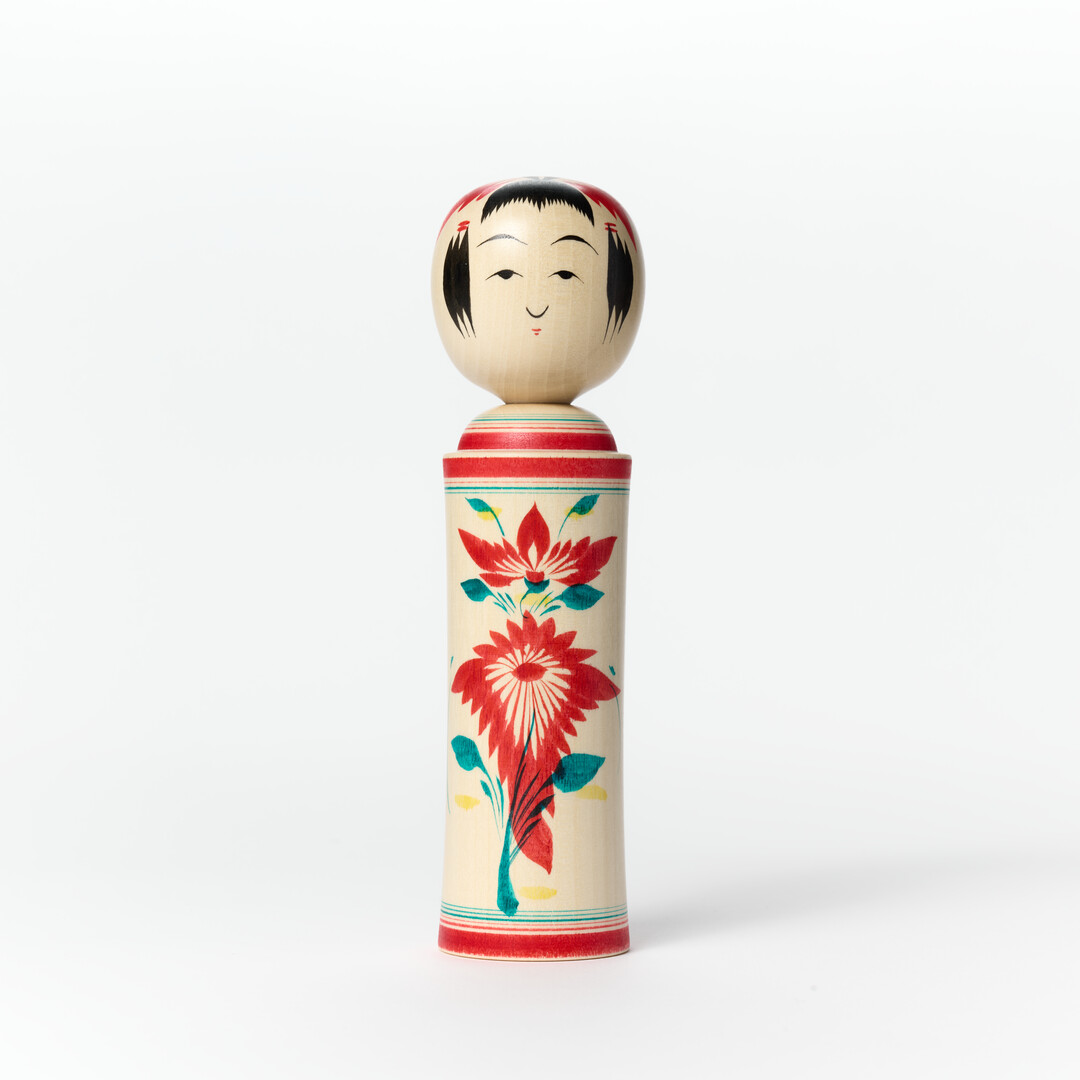 A kokeshi doll with nadeshiko (a Japanese wildflower) pattern