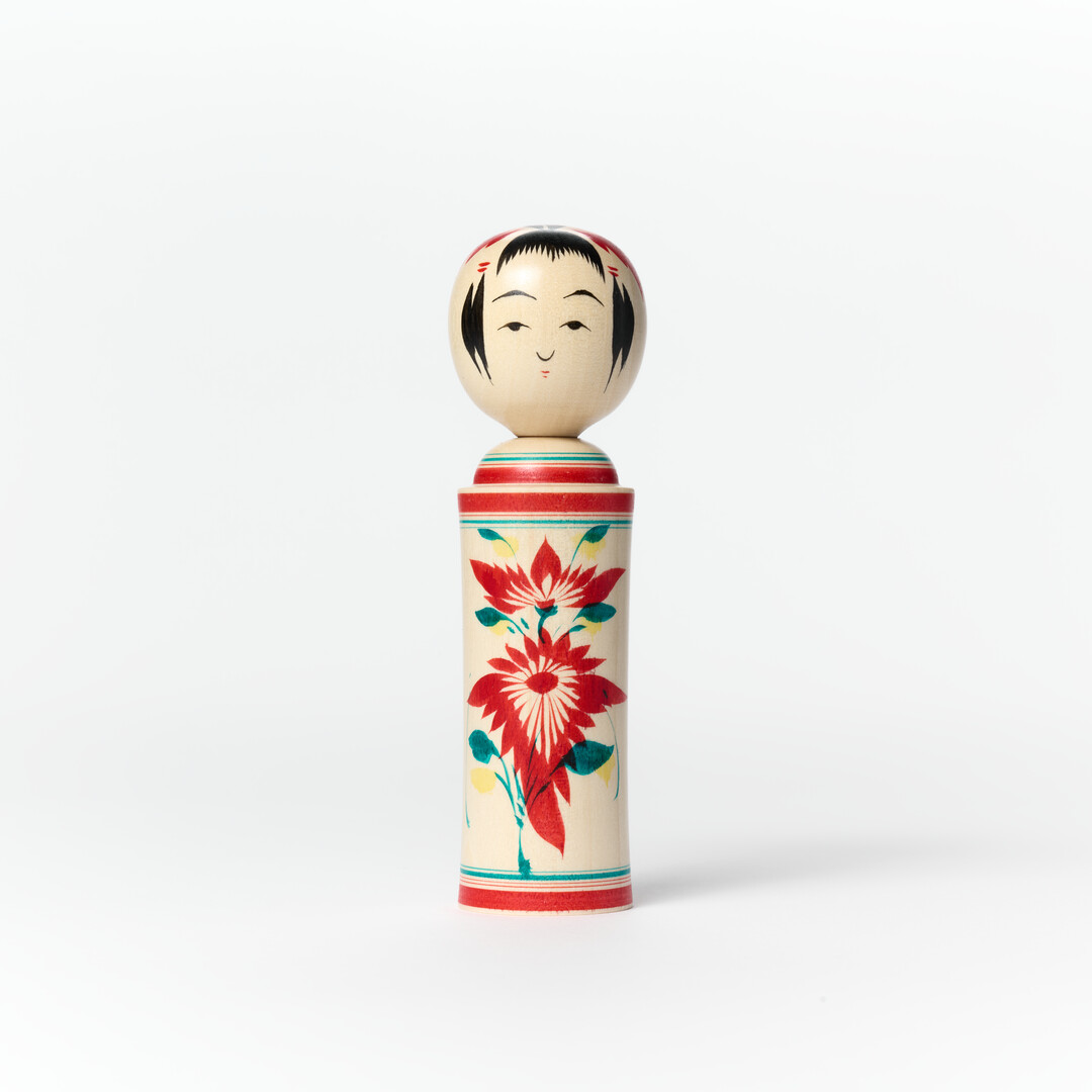 A kokeshi doll with nadeshiko (a Japanese wildflower) pattern
