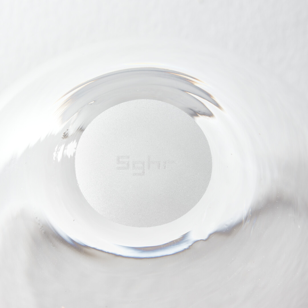 An engraving of Sugahara Glass emblem in glass from Japan House London