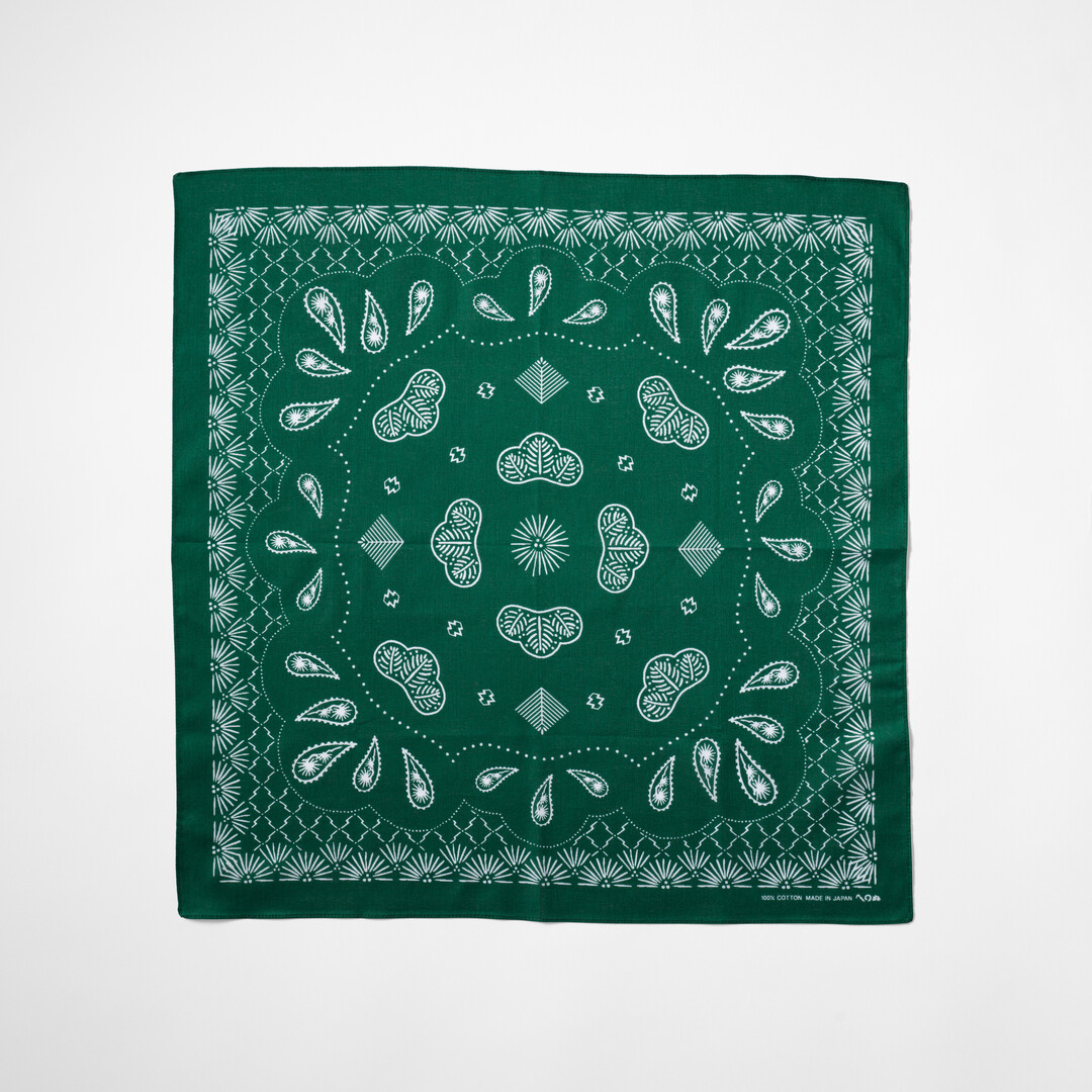 Green bandana with pine tree pattern by Kamawanu from Japan House London.